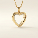 Gold heart-shaped pendant on a beige background