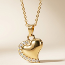 Gold heart-shaped pendant necklace on a beige background