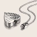 Heart-shaped silver pendant with engraved text on a white background