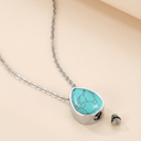 Necklace with turquoise pendant on a beige background