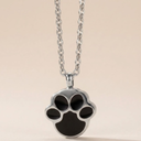Paw print necklace on a beige background
