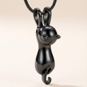 Black cat-shaped pendant on a chain against a beige background