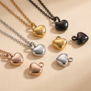 Heart-shaped pendants in various colors on a beige background
