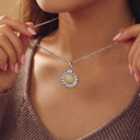 Necklace with a sunflower pendant worn by a person