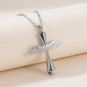 Silver cross pendant with wings on a beige background